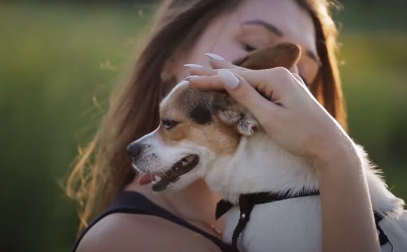 woman hold her dog